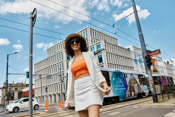A woman in a stylish outfit walks on a European street. — Stock Photo