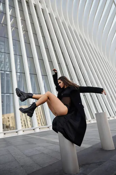 A young woman dances on a city street in New York City. — Stock Photo