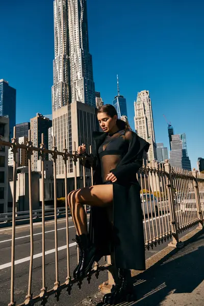 A young woman dances on a New York City street, bathed in sunlight. — Stock Photo