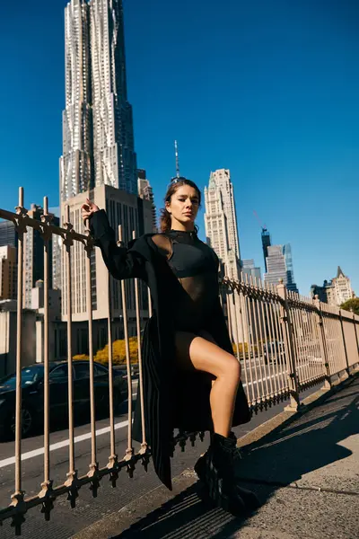 Young woman dances in NYC streets, energy against skyscrapers. — Stock Photo
