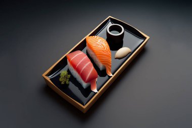 sushi with salmon, tuna, wasabi, ginger, black background, japanese food