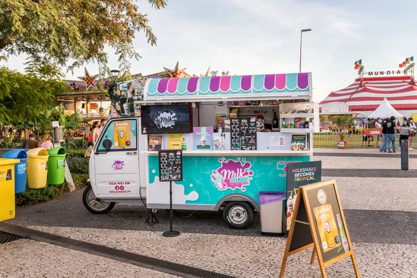 stock image Funchal, Madeira, Portugal - December 31, 2021: Ice cream peddler in a tourist square near the port where people pass by on a winter day