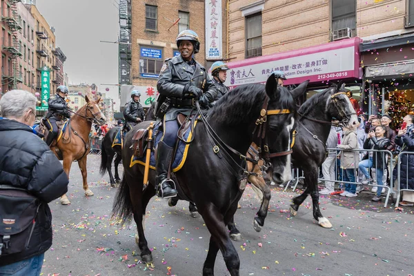 stock image New York, Chinatown, USA - February 12, 2023: Mounted police parading through Chinatown before the Chinese New Year parade on a winter day