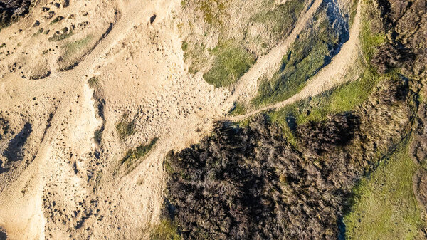 Sand path in the dunes near Sauzaie beach in Brtignolles sur Mer, France. Aerial view by drone