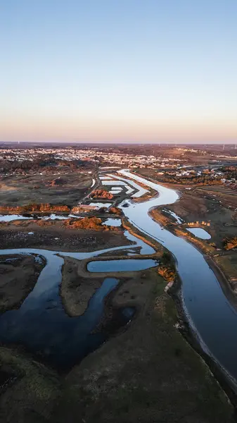 Aerial drone view of the Gachere marshes in Brem sur Mer, Vendee, France on a winter day at sunset