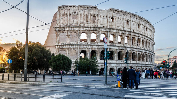 Rome, Italy - December 27, 2023: view of the Coliseum of Rome visited by tourists in the historic city center on a winter day