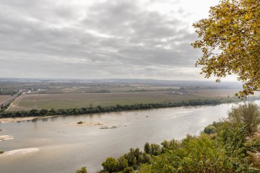 Aerial view of the Tagus River in the Portuguese countryside near Santarem, Portugal on an autumn day clipart