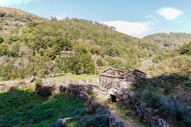 small stone construction in the Geres valley near Sistelo, Viana do Castelo, Portugal on an autumn day clipart