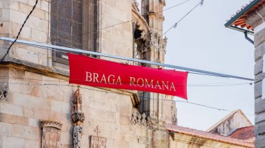 Braga, Portugal - May 26, 2024: Street atmosphere in the historic city center during the Braga Romana event with visitors walking around on a spring day clipart