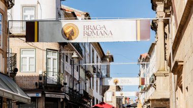 Braga, Portugal - May 26, 2024: Street atmosphere in the historic city center during the Braga Romana event with visitors walking around on a spring day clipart