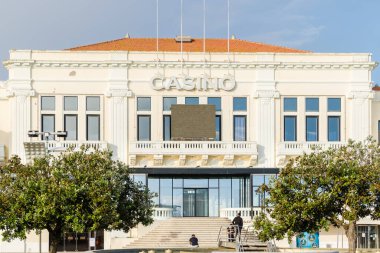 Povoa de Varzim, Porto, Portugal - October 22, 2020: view of the city's casino by the seaside on an autumn day clipart