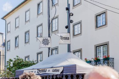 Braga, Portugal - May 26, 2024: Street atmosphere in the historic city center during the Braga Romana event with visitors walking around on a spring day clipart