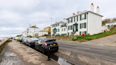 Sandgate, near Folkestone, England - December 30, 2024: Architecture and ambiance on coastal houses on the English Channel on a grey winter day clipart