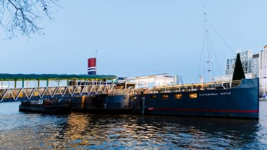 London, United Kingdom - January 02, 2025: The Tattershall Castle restaurant, a pub set on a former ferry moored on the banks of the Thames, Westminster on a winter evening clipart