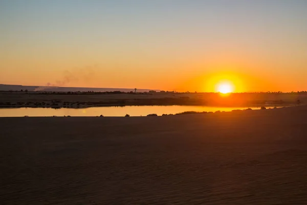 Sun set on magic lake surrounded by desert at Fayoum, sun set  shot