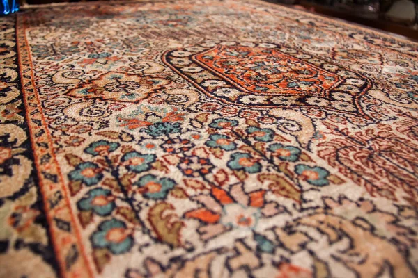 Old vintage oriental handmade colorful carpet, shot is selective focus with shallow depth of field. Photo is taken on 12 January 2023 at Cairo Egypt
