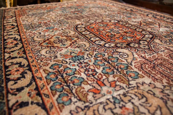 Old vintage oriental handmade colorful carpet, shot is selective focus with shallow depth of field. Photo is taken on 12 January 2023 at Cairo Egypt
