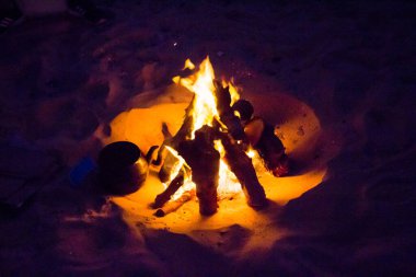 Fire flame shot on the background of the fireplace at a night picnic in Fayoum City, Egypt
