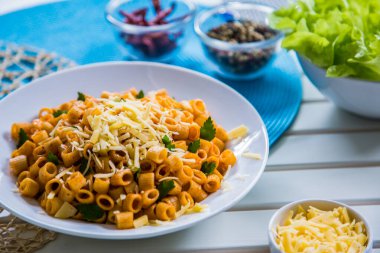 Pasta food shot with and without sauce, shot is selective focus with shallow depth of field. Photo taken at Cairo Egypt