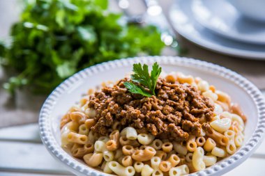 Pasta food shot with and without sauce, shot is selective focus with shallow depth of field. Photo taken at Cairo Egypt