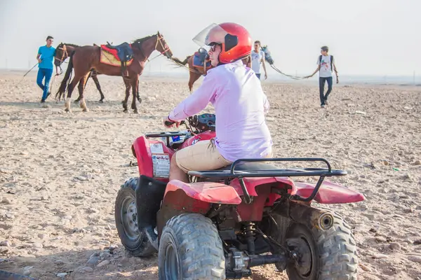 stock image Tourism holidy sport activity, desert safary ride on off road 4x4 buggy bike, joyful happy people enjoy extreme fun time, shot selective focus with sahllow depth of field, Cairo Egypt on 15 june 2015