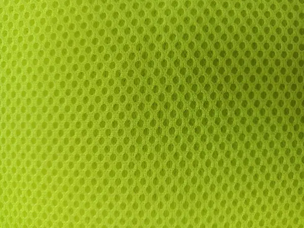 Parlak yeşil bir ağ kumaşı. Kumaşın dokusu çok açık, küçük deliklerden oluşan düzenli bir desen var..