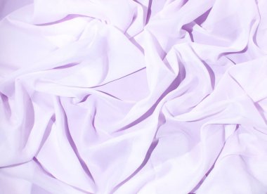 Pürüzsüz eflatun ipeği ya da saten dokusu düğün arka planı olarak kullanılabilir. Lüks arkaplan tasarımı