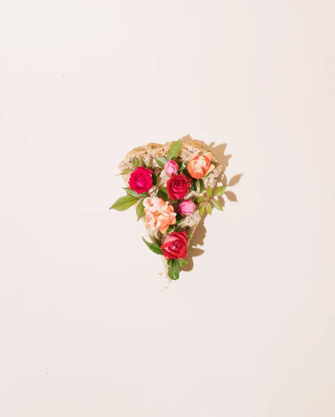 stock image Slices of pizza made of summer flowers and leaves. Minimal creative food concept. flat lay.