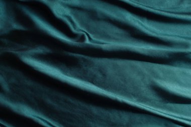 Pürüzsüz koyu turkuaz mavi saten dokusu soyut arkaplan olarak kullanılabilir. Lüks arkaplan tasarımı