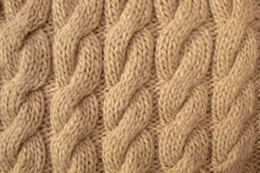 Kış yünü el yapımı bej kazak. Tekstil arkaplanı