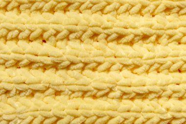 Kış yünü el yapımı sarı kazak. Tekstil arkaplanı