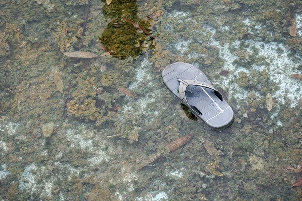 lampung, November 2022 -  flip-flops left in the water can describe evidence and clues to a crime