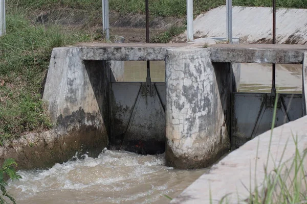 stock image water flow at the flood gate of the irrigation canal