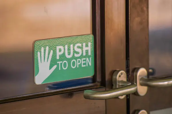 Close-up of the door with sign on it