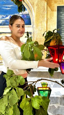 model posing in the Day of the Lanterns, a traditional Catholic festival held every September 7th, where thousands of lanterns are lit with beeswax candles clipart