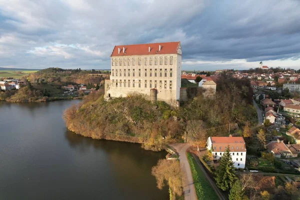 Aerial view of picturesque Czech town Plumlov with castle, Olomouc Region,reflected on the surface of Plumlov Lake, designed by Charles Eusebius of Liechtenstein. Tourist spot, Czech republic