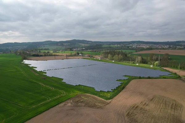 stock image Modern solar power plant, photovoltaic panels green energy electricity production,new power plant,European energy crisis 2022, green deal,Czech republic,European Union,aerial panorama from foggy cloud