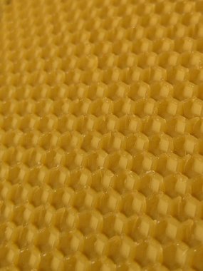 Sarı balmumu bal peteğinin soyut arkaplan veya doku arkaplanı.