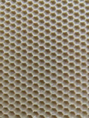 Sarı balmumu bal peteğinin soyut arkaplan veya doku arkaplanı.