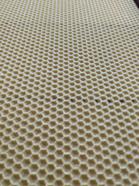 Sarı balmumu bal peteğinin soyut arkaplan veya doku arkaplanı.