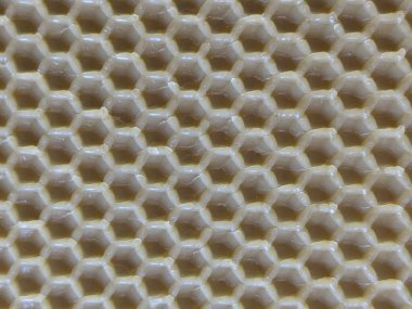 Sarı balmumu bal peteğinin soyut arkaplan veya doku arkaplanı.