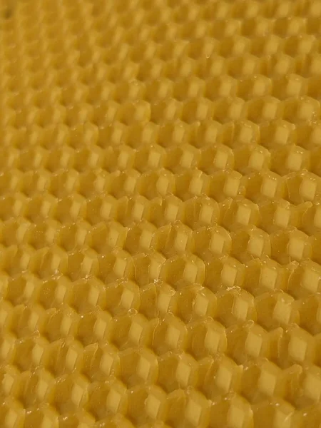 黄色の蜜蝋の抽象的な背景や質感の背景 養蜂の養液栽培 ロイヤリティフリーのストック画像