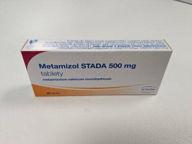 Prague, Czech Republic - July 10 2024: Metamizol Stada box of medication with metamizole active substance by Stada, used for treatment of pain, fever, and spasms. clipart