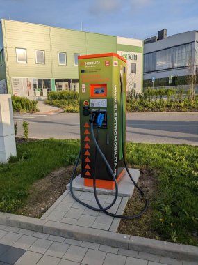 Humpol, Czech Republic - SEPTEMBER 13 2024: KAUFLAND and E.ON electric car supercharger station, providing fast charging solutions for electric vehicles at Kaufland locations, supporting sustainable t clipart