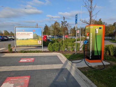 Humpol, Czech Republic - SEPTEMBER 13 2024: KAUFLAND and E.ON electric car supercharger station, providing fast charging solutions for electric vehicles at Kaufland locations, supporting sustainable t clipart