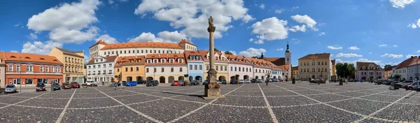 stock image Bilina,Czech republic-July 9 2023:Bilina historical city center with fountains and cobble stone square, churches and castle above the old town