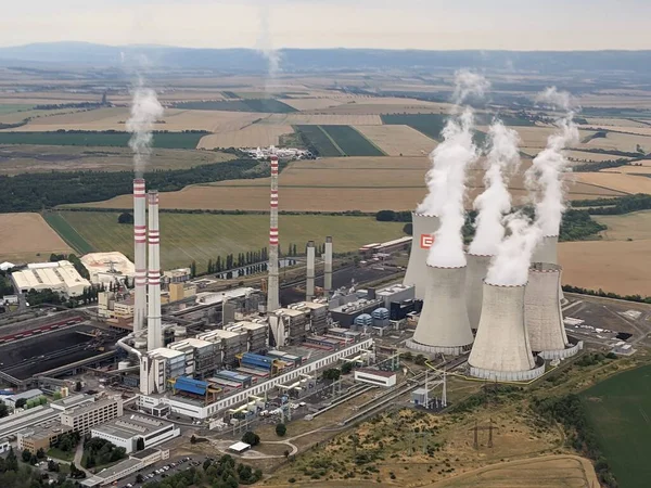 stock image Pocerady, Czech republic - June 28 2023: Aerial panorama view of Pocerady coal power plant with smokestacks and cooling towers in the middle of nothern Bohemian landscape.Huge energy sources