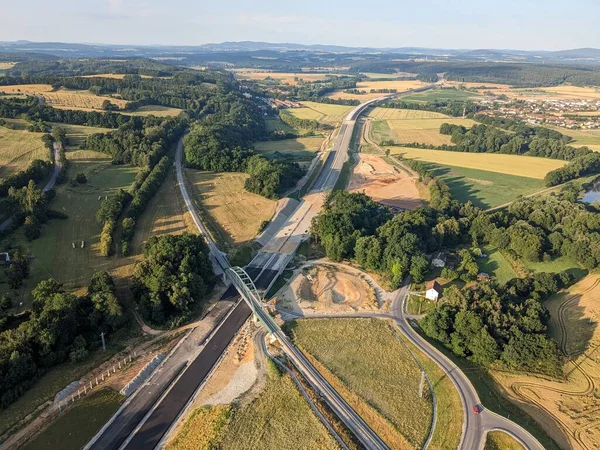 stock image construction of new highway,speed road construction work with bridges and modern infrastructure,Czech republic-Europe highway Ceske Budejovice aerial panorama landscape view-civil engineering