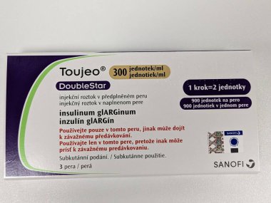 Prague, Czech Republic - July 10 2024: Toujeo DoubleStar box of medication with insulin glargine active substance by Sanofi, used for treatment of diabetes mellitus and blood sugar control. clipart