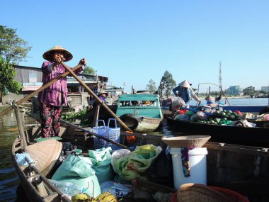 floating market on a river in Vietnam clipart